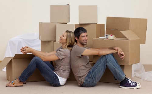 Professional movers loading a van in Creekmouth