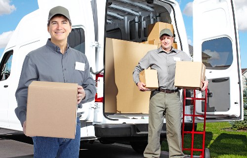 Professional movers loading a van in Stamford Hill