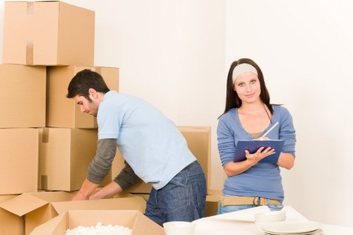 Professional movers handling furniture with care