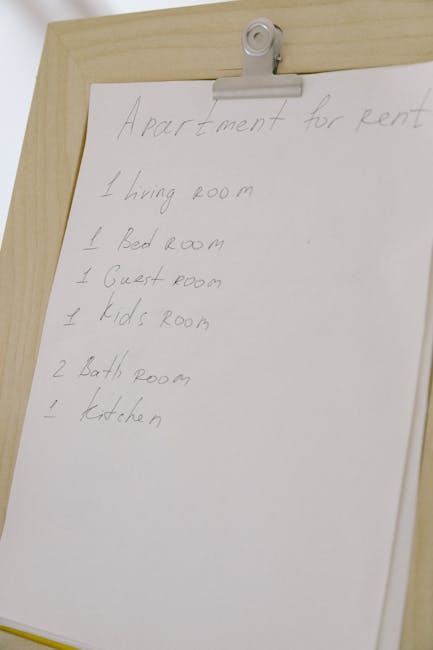 Close-up image of a black marker pen resting on a white sheet of paper with a checklist of six items, each marked with a green checkmark inside a black circle. The checklist is arranged vertically, wi